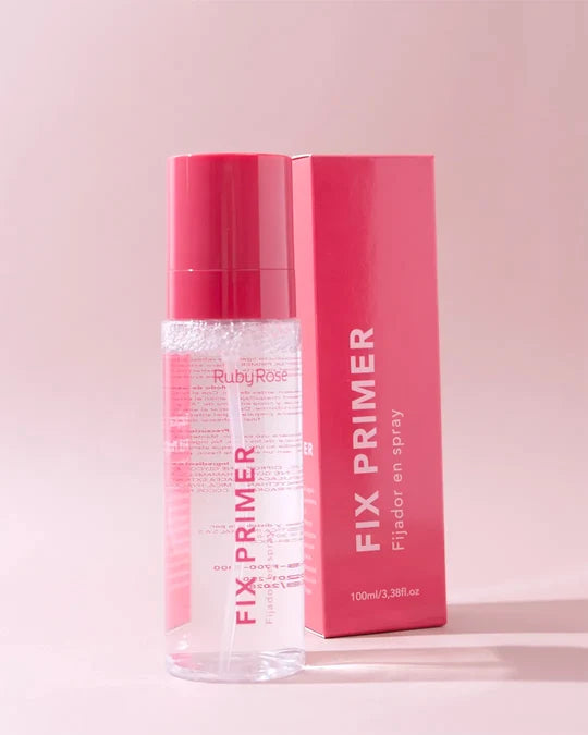Fix Primer Ruby Rose fijador de maquillaje en spray junto a su caja sobre fondo rosa.